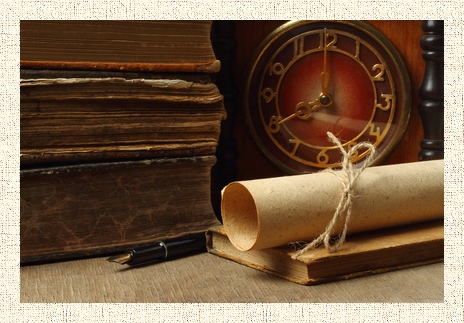 Retro composition with books, clock, paper and pen on wooden background